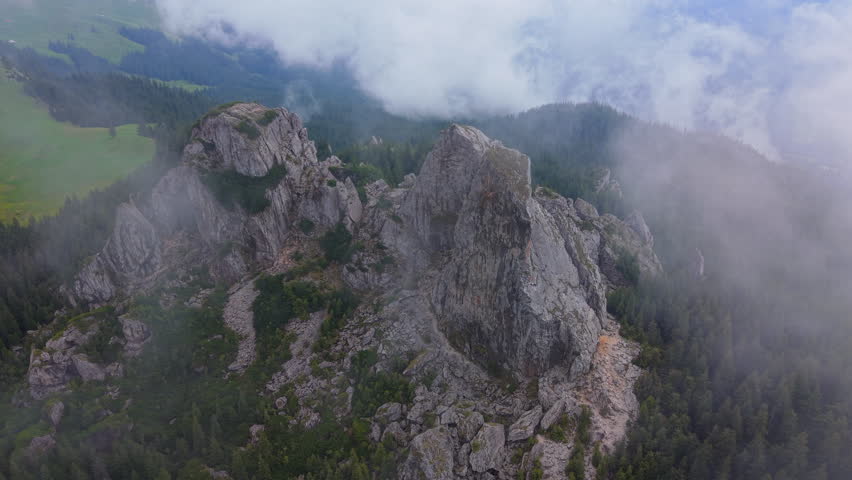 Clouds passing over Pietrele Doamnei, a geological and touristic attraction in Rarau Mountains, Eastern Carpathians, Romania