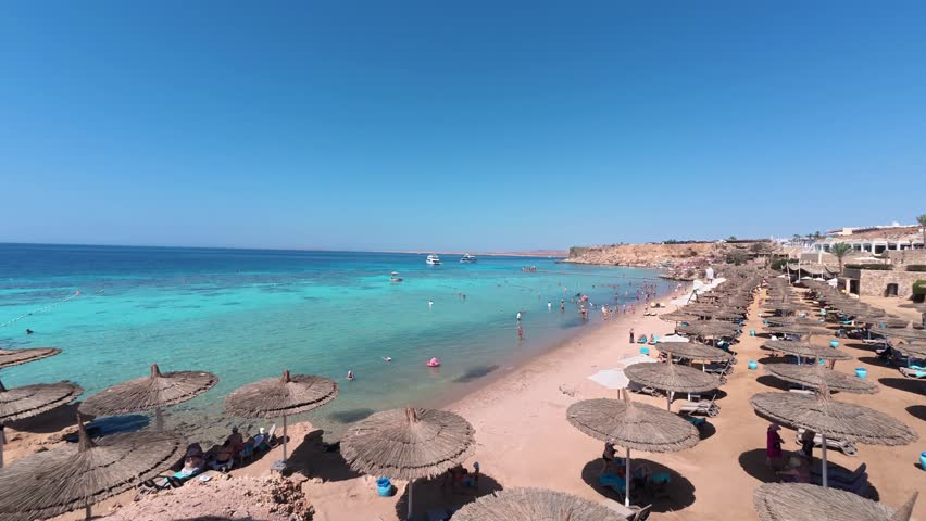 People at Red sea resort. Beach of tropical sea resort. Sharm El Sheikh, Egypt. Timelapse footage
