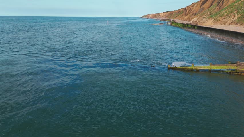 English coastline beach rocky cliffs landscape aerial drone Sheringham United Kingdom