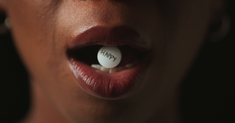 Mouth, pills and addiction in studio closeup with text for mind altering drugs by black background. Person, tablet and illegal medicine with opioid crisis, mood and happy with chemical compound