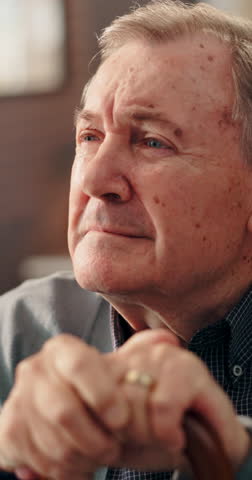 Sadness, thinking and walking stick with senior man in retirement home for loss or nostalgia. Depression, grief or memory and old person with cane in apartment for loneliness, mistake or regret
