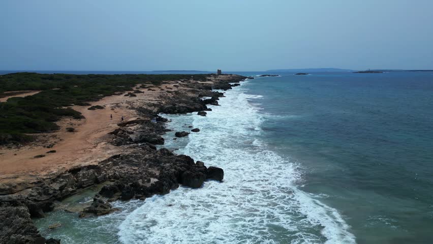 Cliff Bays at Ses Salines beach Ibiza Spain. Great aerial view flight drone