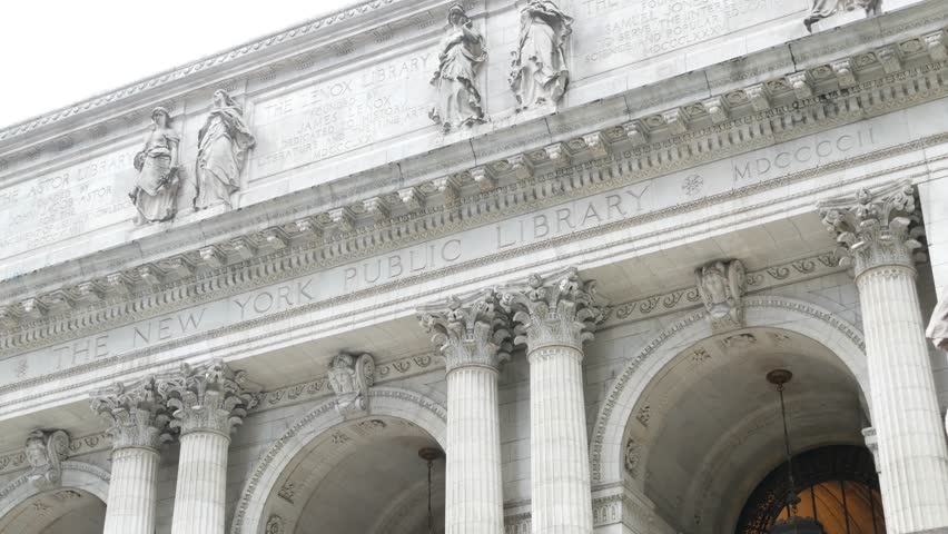 New York City, Manhattan Midtown Bryant Park. Public library building architecture, 42 street and 5th Fifth 5 avenue corner, United States. NYC landmark in USA. Facade exterior and lion sculpture