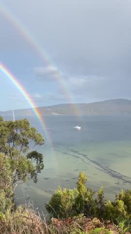 Double Rainbow Over Coastal Forest and Bay