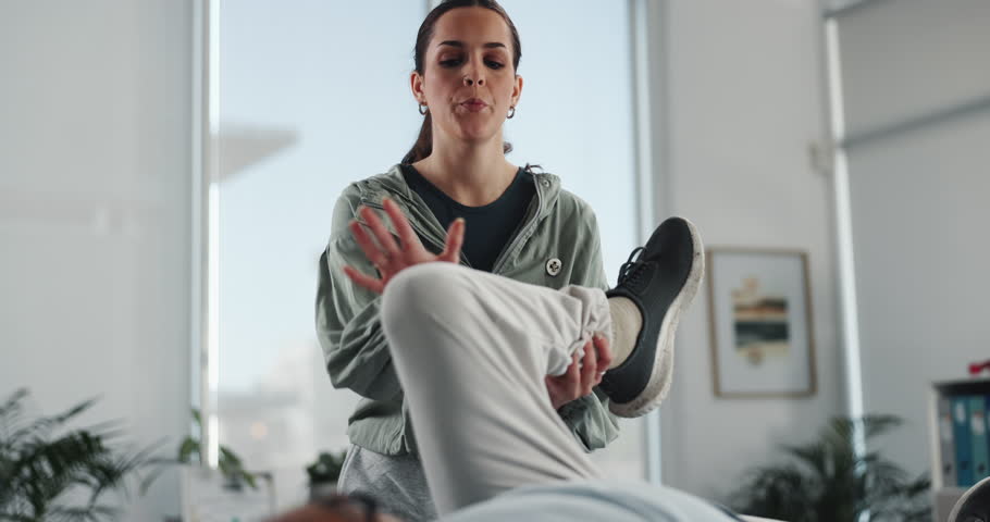 Physiotherapy, knee pain and woman with patient for consulting, medical service and support. Healthcare, physical therapy and person with man for rehabilitation, recovery and stretching for mobility