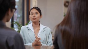 Asian businesswoman presenting a marketing or business strategy to her colleagues during a team meeting in a modern office. Professional discussion and collaboration scene suitable. - Powered by Shutterstock - Get 15% off with code: PIKWIZARD15