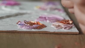 Artist's Hands Applying Textured Paint with Metallic Flakes Creative Decorating Surface Process - Powered by Shutterstock - Get 15% off with code: PIKWIZARD15