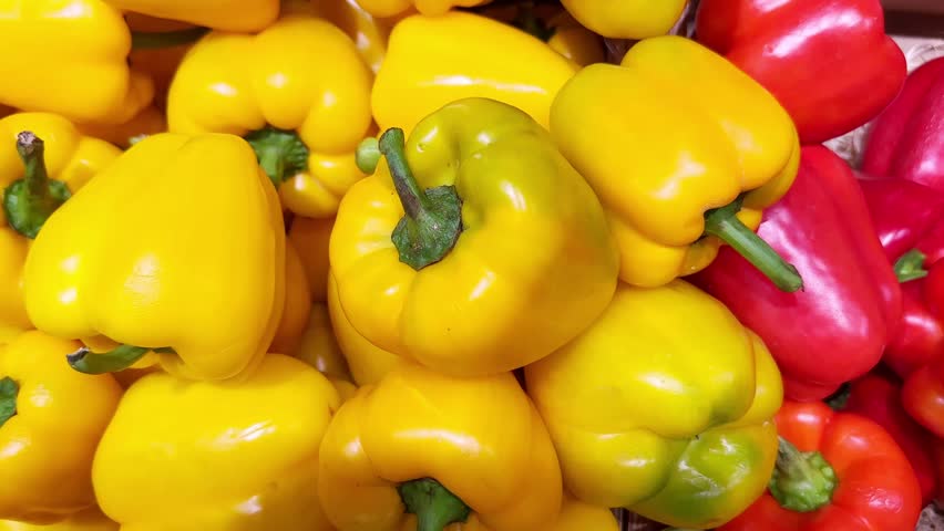 choosing peppers, beans, peas at the grocery store