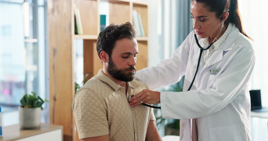 Doctor, patient and breathing with stethoscope in hospital for chest exam, asthma or checkup. Cardiology expert, people or medical tool for heartbeat, lung capacity or health assessment on clinic bed