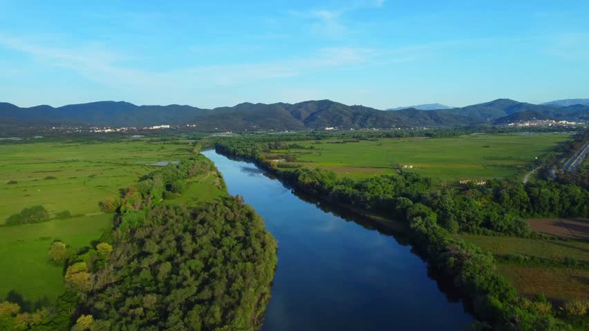 Aerial View of river, Beautiful Aerial View of African Jungles forest and River, Landscape in aerial drone shot. Adove calm tranquil river in Jijel Algeria North Africa, River and green fores trees.
