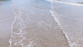 Gentle waves roll under a cloudy sky at Ubatumirim Beach in Ubatuba, Brazil. - Powered by Shutterstock - Get 15% off with code: PIKWIZARD15