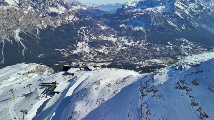 Cortina d'Ampezzo, Italy: Aerial view of famous ski resort in Dolomites (Dolomitic Alps)  and venue of Winter Olympics Milano Cortina 2026, sunny day - landscape panorama of Europe from above