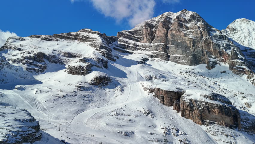 Cortina d'Ampezzo, Italy: Aerial view of famous ski resort in Dolomites (Dolomitic Alps)  and venue of Winter Olympics Milano Cortina 2026, sunny day - landscape panorama of Europe from above