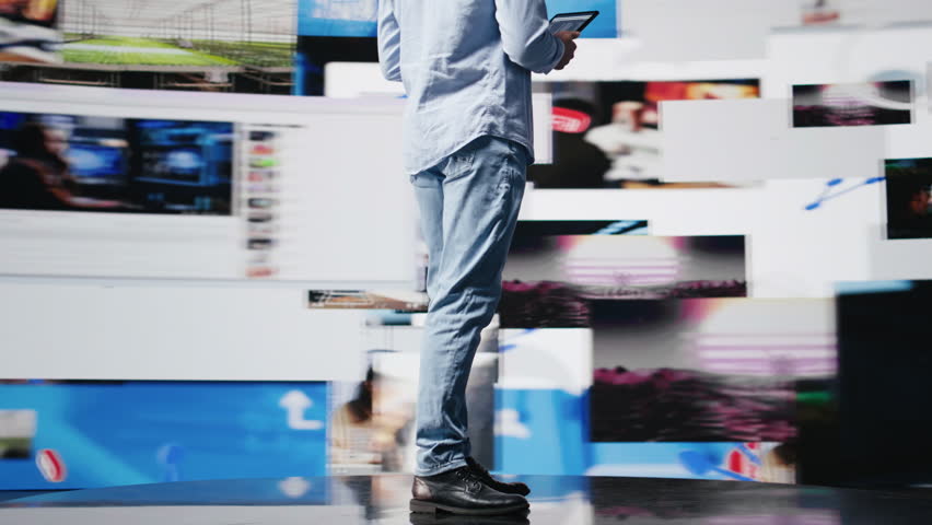 Young modern person focused on his smartphone app and scrolling on social pages, texting his friends and creating quality content for global reach. Cool guy on web connection. Camera B.
