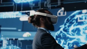 Modern businessman uses virtual reality gadget next to neural network system, using cybernetics and robotics for deep learning concept. AI brain automation tools for development. Camera A. - Powered by Shutterstock - Get 15% off with code: PIKWIZARD15
