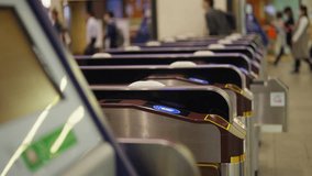 Crowd of People walking pass ticket gate in subway station in rush hour morning. Passenger using card and smartphone mobile app making payment for public transportation at train station in the city. - Powered by Shutterstock - Get 15% off with code: PIKWIZARD15