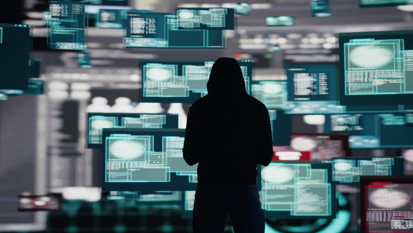 Male hacker breaking into a system in stealth mode by programming code, bypassing firewalls and exploiting vulnerabilities in network security to carry out cyber attack and infiltration. Camera B.