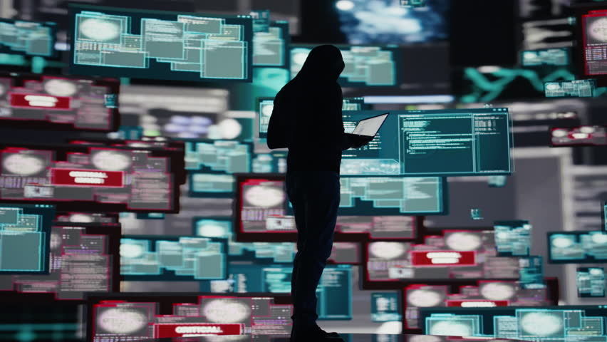 Conceptual representation of cyber crime with male hacker exploiting system vulnerability, using programming technique and surveillance to override digital defenses and leak information. Camera B.
