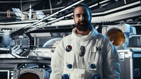 Cheerful astronaut doing videocall with Earth command center while aboard orbit station, sharing mission update. Happy cosmonaut talks with ground center team during communication link, camera A - Powered by Shutterstock - Get 15% off with code: PIKWIZARD15