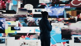 Smartphone user addicted by social media content consumption and obsessive doomscrolling that can trigger anxiety and harmful self esteem issues in the digital world. Overuse isolation. Camera B. - Powered by Shutterstock - Get 15% off with code: PIKWIZARD15