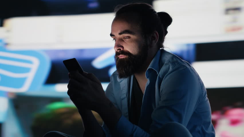 Young person in solitude affected by anxiety and manipulation, highlighting suffering due to obsessive social network overuse. Information overload from constant interaction cause damage. Camera A.