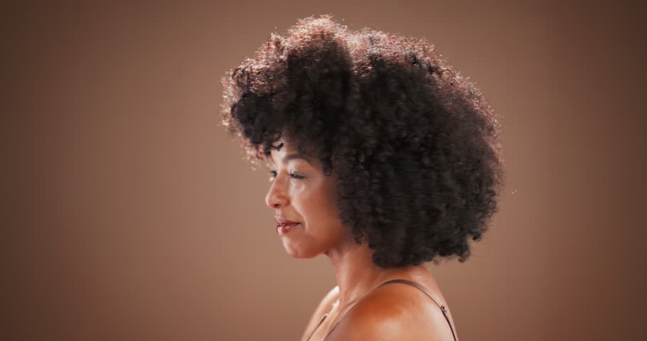 Beauty, hair care and face of black woman in studio for wellness, cosmetics and spa treatment. Hairdresser, aesthetic and portrait of person with smile for growth, healthy and natural hairstyle