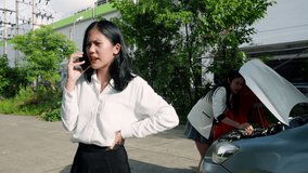 Asian woman was dressed go work, driving out, got into car accident, woman is calling on leave from work, due accident, In back, car mechanic insurance employee are inspecting damage. - Powered by Shutterstock - Get 15% off with code: PIKWIZARD15