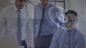 Business colleagues inspecting laptop with digital overlay appearing typing and pointing in meeting. Technology, innovation, teamwork, digital, modern, corporate, data - Powered by Shutterstock - Get 15% off with code: PIKWIZARD15