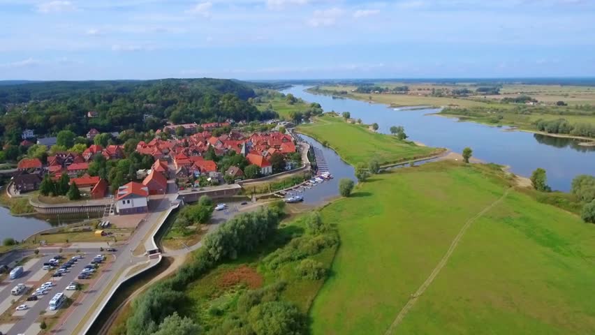 Aerial View of Riverbank Town and Winding River