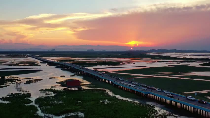 Aerial View of Highway Bridge at Sunset over Wetlands