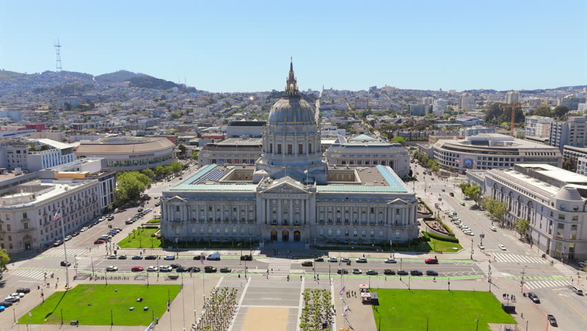Amazing aerial drone footage beautifully showcases the incredible architectural beauty of San Francisco City Hall, which stands majestically amid the bustling and vibrant city life surrounding it
