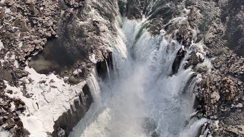 Aerial view of Selfoss waterfall cascading through icy terrain in northern Iceland. Selfoss, Iceland