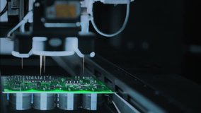 Close-up: machine installs components on circuit board. Electronic devices PCB industry. Factory of graphics processing unit, GPU processor. Production of video cards for artificial intelligence. - Powered by Shutterstock - Get 15% off with code: PIKWIZARD15