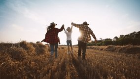 Summer in countryside, farmer family enjoying simple life, parents and kids. Children, mother and father walking together farmland during harvesting, family business in agriculture, eco farming - Powered by Shutterstock - Get 15% off with code: PIKWIZARD15