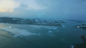 At frame three teal digital network glowing, drifting upward over snowy coast mapping wave contours. Aerial view, landscape, technology, connectivity, nature, innovation, digital - Powered by Shutterstock - Get 15% off with code: PIKWIZARD15
