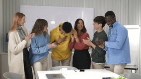 Professional diverse team clapping, celebrating shared project success with enthusiastic workplace camaraderie and collaborative energy - Powered by Shutterstock - Get 15% off with code: PIKWIZARD15