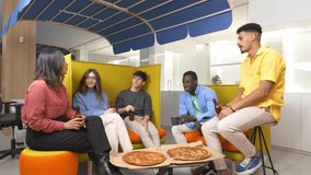 Team of diverse professionals bonding over pizza, sharing casual conversation and enjoying downtime during workplace break in modern, colorful office environment - Powered by Shutterstock - Get 15% off with code: PIKWIZARD15