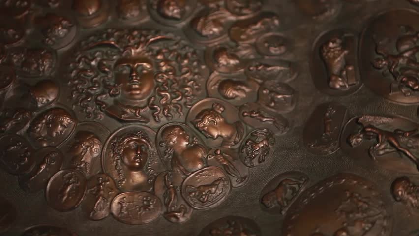 bronze aegis with the gorgon Medusa in the center and Greek mythological gods