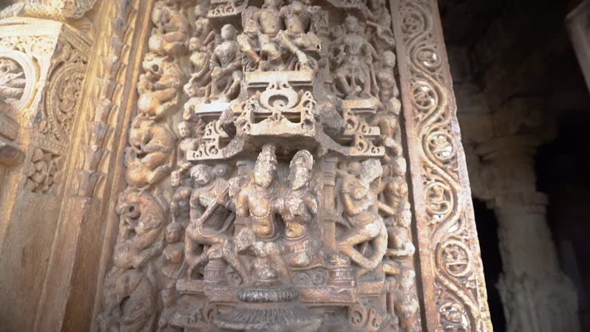 A detailed stone sculpture featuring mythological figures and ornate patterns, showcasing ancient Indian craftsmanship.