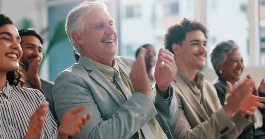 Clapping, success and mature business man in audience for meeting, workshop and deal. Applause, celebration and conference with group of employees at convention for seminar event, crowd and support