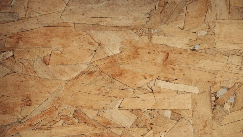 Oriented Strand Board wood texture background. Stop motion animation of OSB engineered wood. Full HD and looping animation.