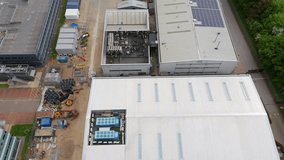 Aerial drone shot of business district warehouses and data centres cooling fans industrial manufacturing quantum computing area near Stevenage England UK - Powered by Shutterstock - Get 15% off with code: PIKWIZARD15
