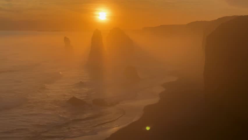 Rare sunset footage of the Twelve Apostles shrouded in mist along Australia