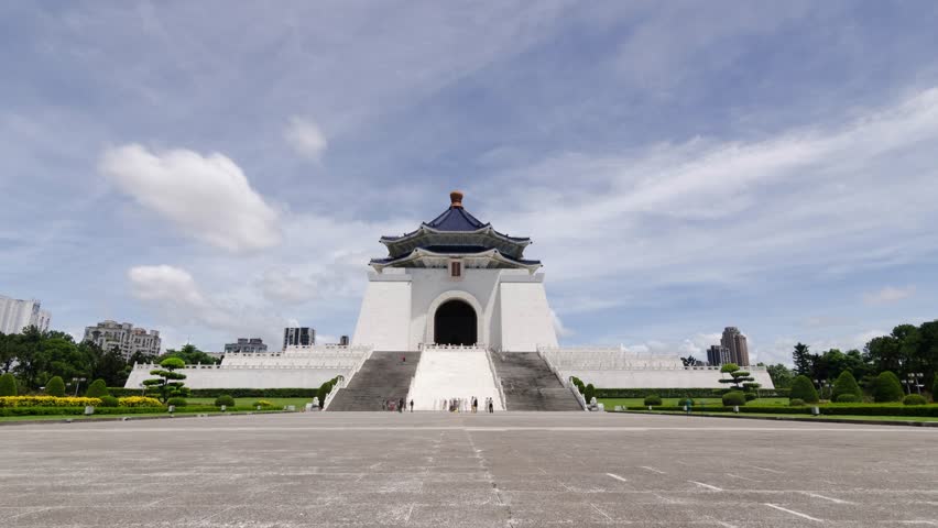 time lapse landscape view at Chiang Kai Shek Memorial hall in Taipei City, Taiwan among sunny day time. beautiful architecture building famous tourist landmark national monument of Taiwan
