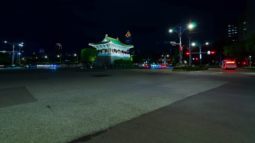 night timelapse street view with many traffic transportation around roundabout of Taipei ancient east gate with long light exposure shutter speed,transportation in night city of Taiwan
