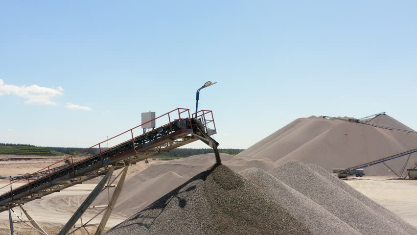 Conveyor Belts Move The Gravel Into The Stockpile At Quarry Site. - aerial shot