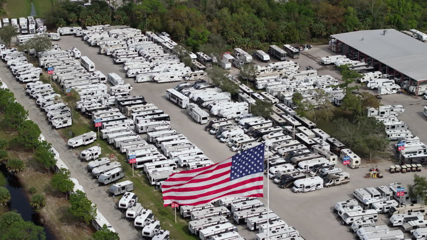 RV dealer parking lot with camping travel trailers for sale in Florida.