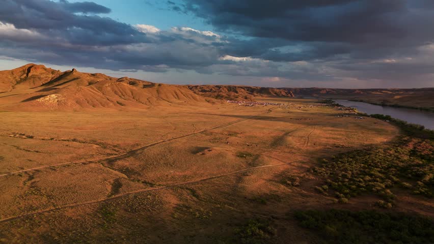 Drone shot of river Ili and spring steppe in Kazakhstan