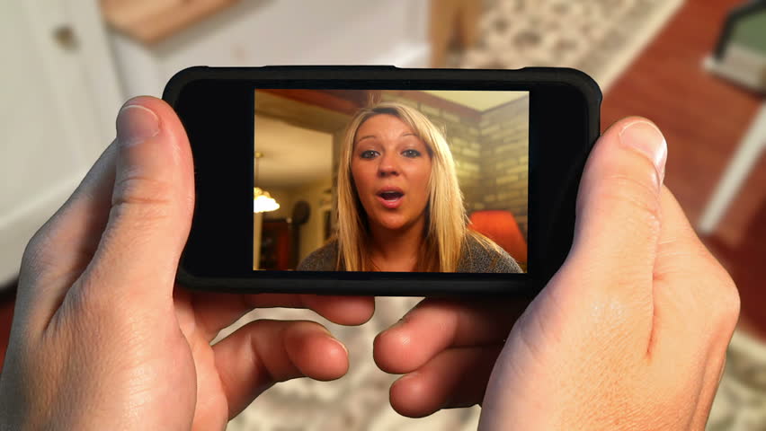 A woman video chats on a mobile smartphone. With luma matte to customize the