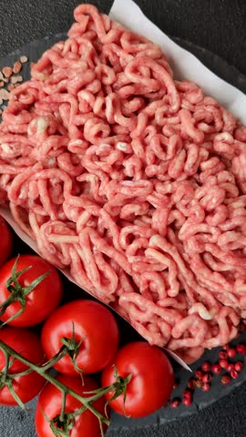 Raw ground beef or pork as an ingredient for burgers. Raw minced meat for cooking at home